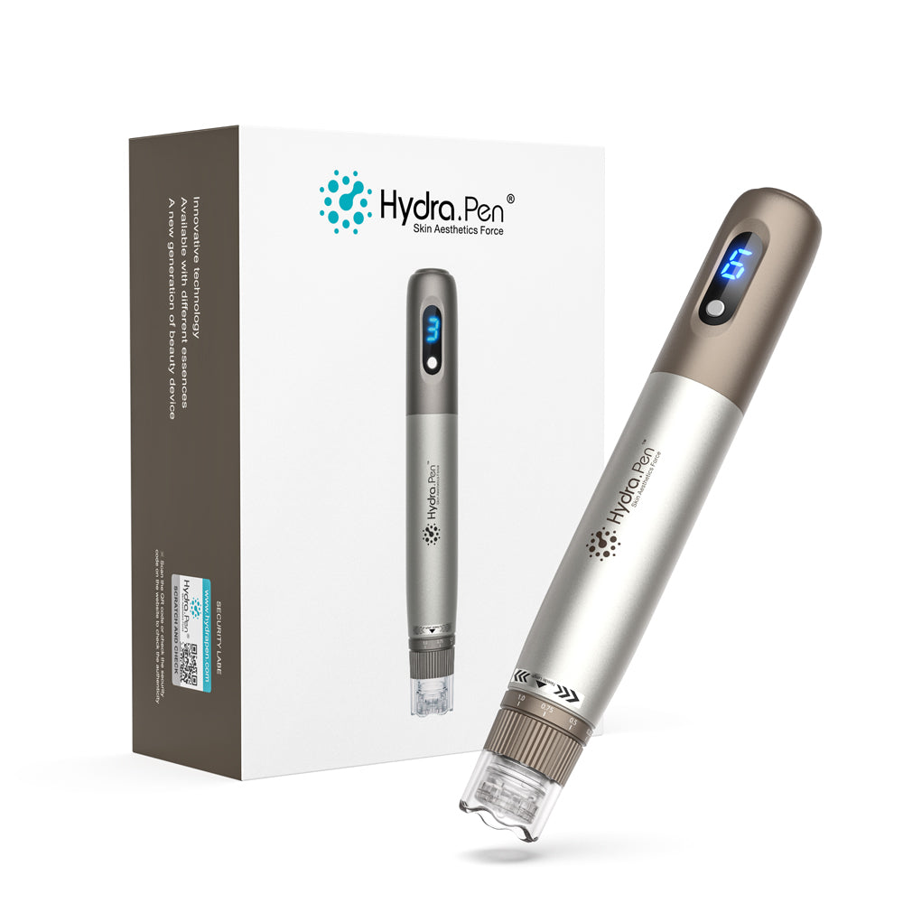מכשיר Hydra Pen H3 בכסף ובברונזה ליד אריזתו המקורית